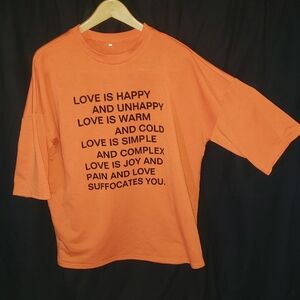 Graphic Orange T-Shirt with Black Text